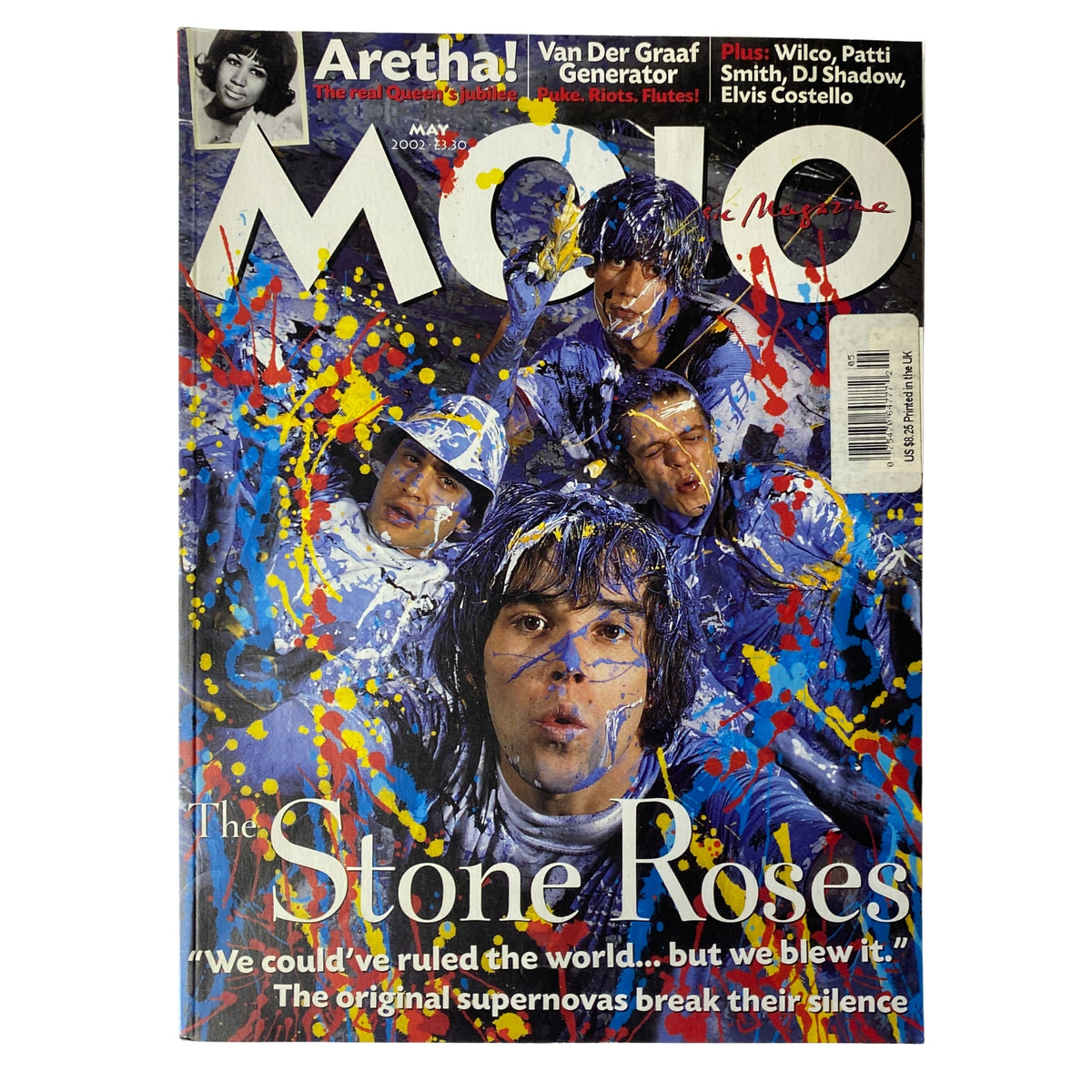 Mojo Music Magazine May 2002 featuring The Stone Roses on the cover, showcasing a vibrant, colorful design.