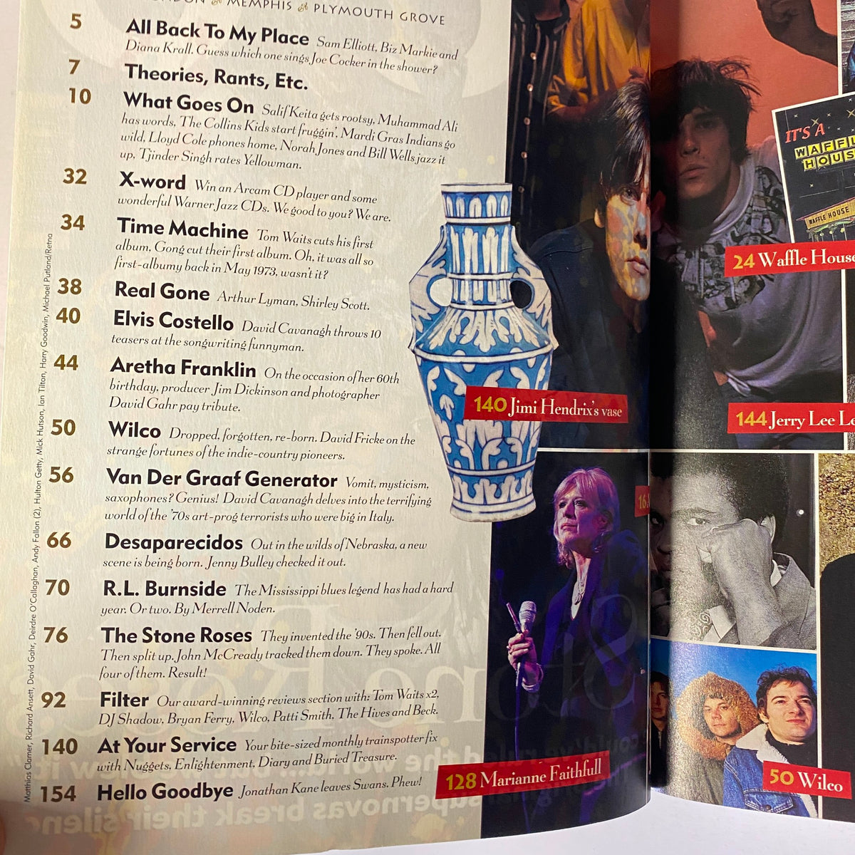 Inside page of Mojo Music Magazine May 2002 listing articles, including features on Elvis Costello and The Stone Roses.