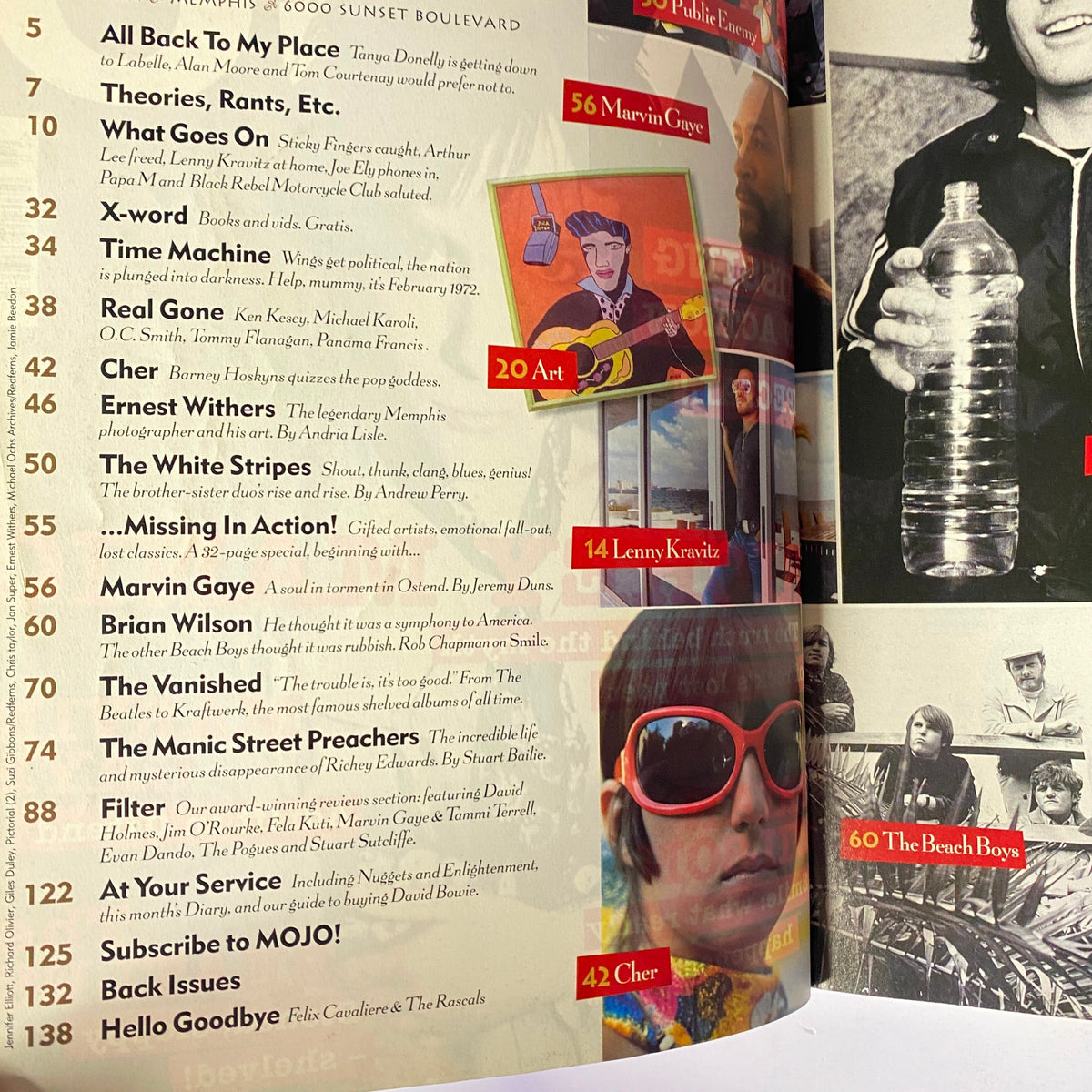Inside page of Mojo Music Magazine February 2002 showcasing the contents list, featuring artists like Cher, The White Stripes, and Manic Street Preachers.