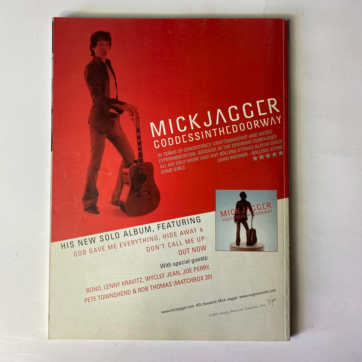 Cover of Mojo Music Magazine January 2002 featuring a tribute to George Harrison. The cover highlights an article with retrospectives on Harrison's musical and spiritual legacy, appealing to fans and rock historians.
