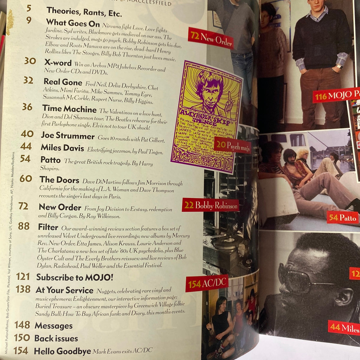 Inside pages of Mojo Music Magazine September 2001, detailing content including features on artists like New Order and Miles Davis, and articles on music culture and history.