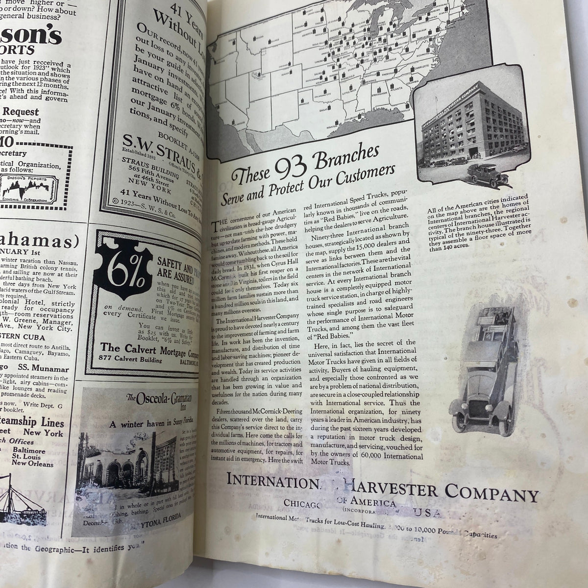 Inside page of the National Geographic Magazine January 1923 showcasing advertisements and content about branches of International Harvester Company.
