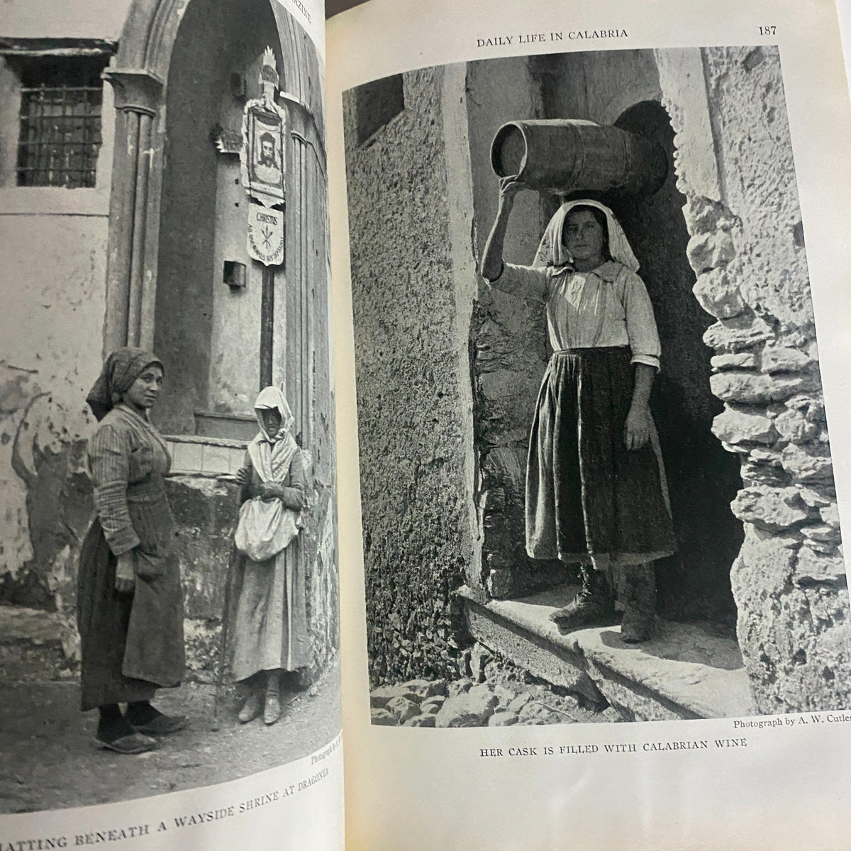 Inside page of National Geographic Magazine February 1923 illustrating daily life in Calabria, featuring a woman balancing a vessel on her shoulder and showcasing historic cultural elements.