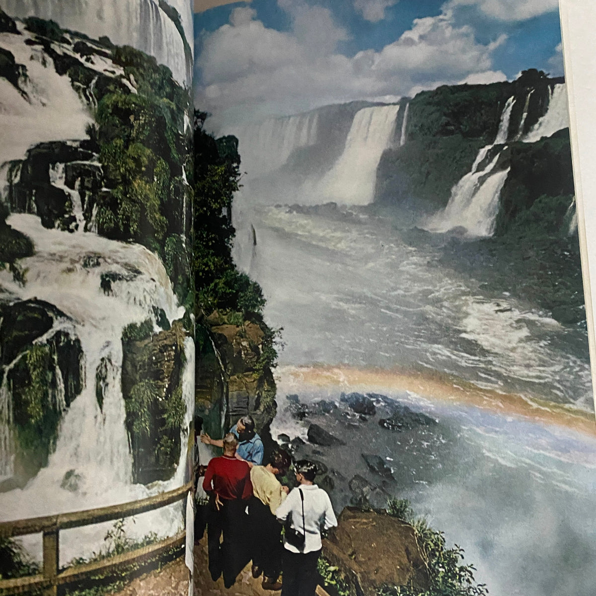 Interior page of National Geographic Magazine January 1967 showcasing stunning image of waterfalls, surrounded by lush greenery and visitors admiring the scenic beauty; highlights travel destinations in Pakistan.