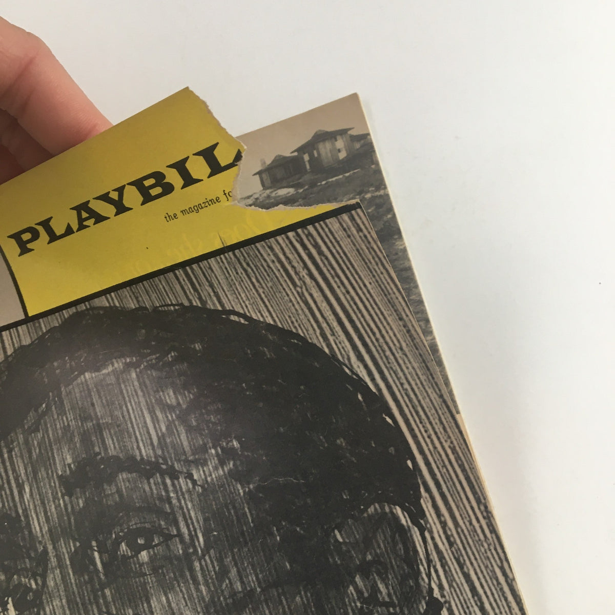 Close-up of the damaged corner of the 1965 Playbill for Sammy Davis in Golden Boy, showcasing its vintage design and historical significance.