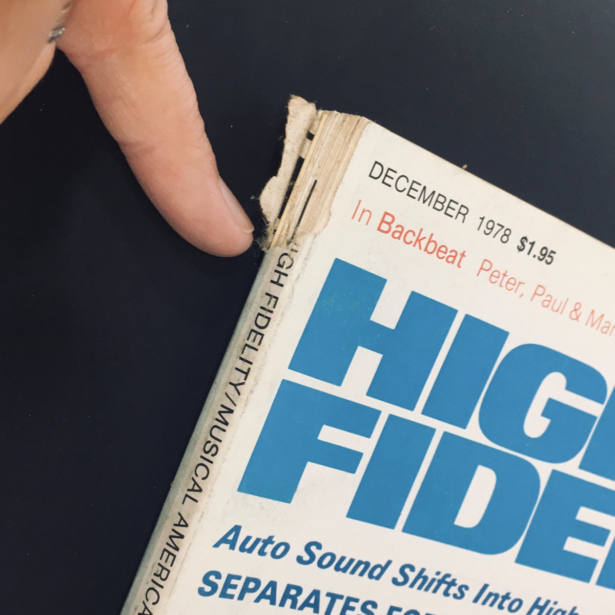 Close-up view of the spine of VTG High Fidelity & Musical America December 1978 magazine showing wear and tear, emphasizing its used condition.