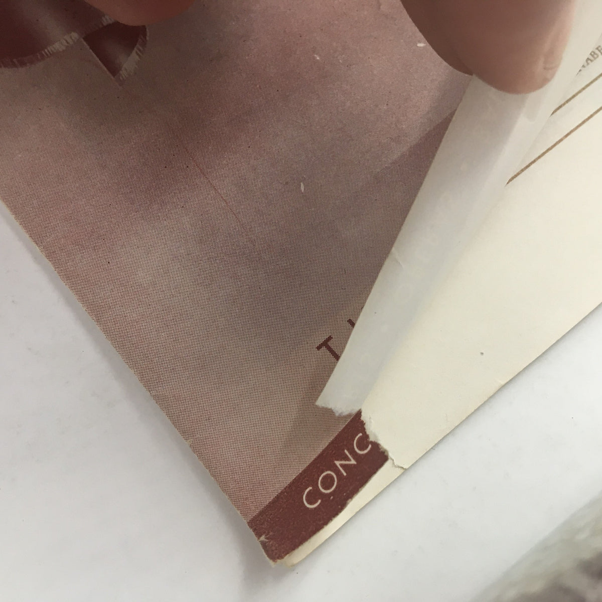 Close-up of the edge of the 1946 Program Magazine from New York City Center featuring Ballet Russe De Monte Carlo, showing minor wear and tear typical of vintage items.