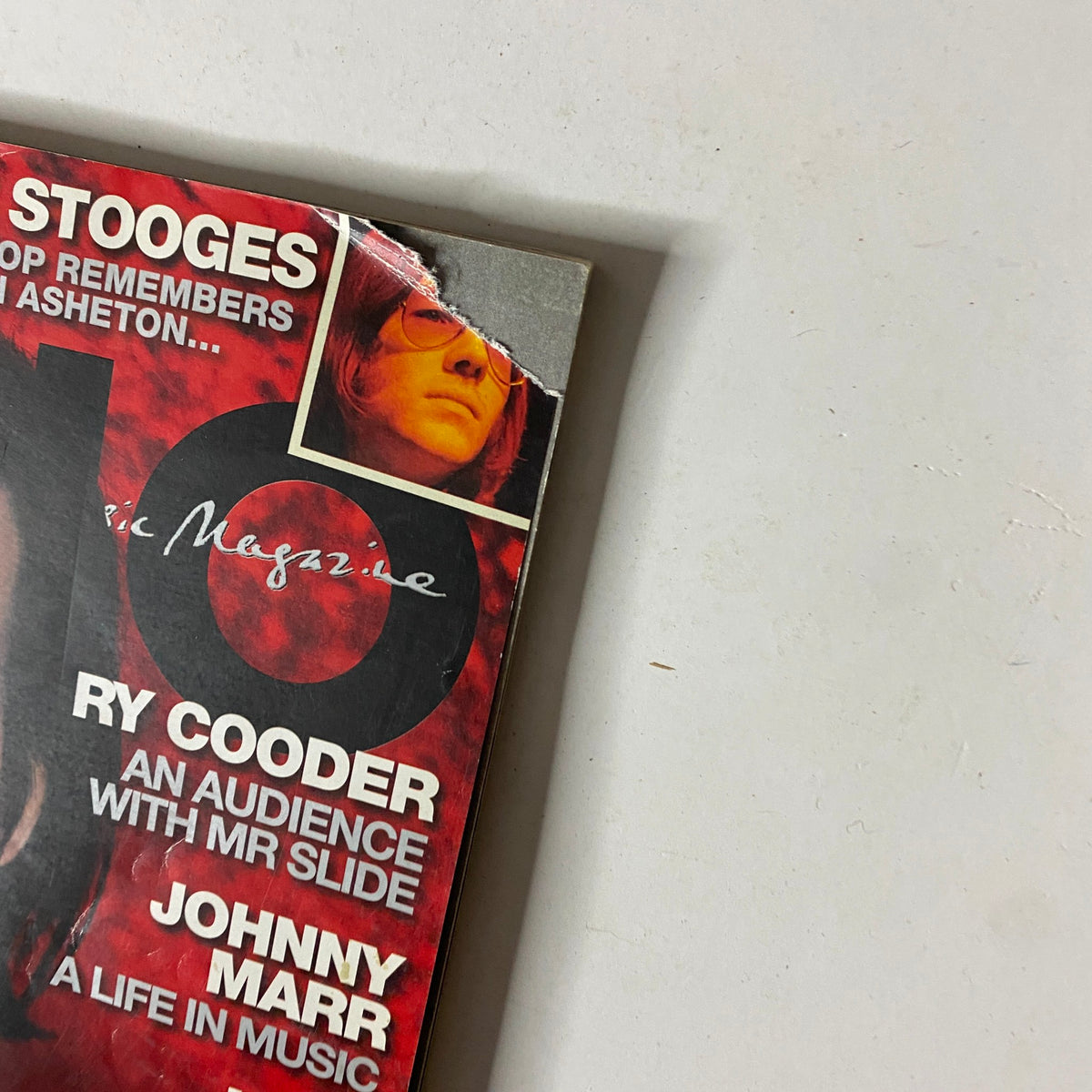Close-up detail of the Mojo Music Magazine March 2009 cover, highlighting the text and images related to prominent artists featured inside, including The Stooges and Ry Cooder. No CD included.