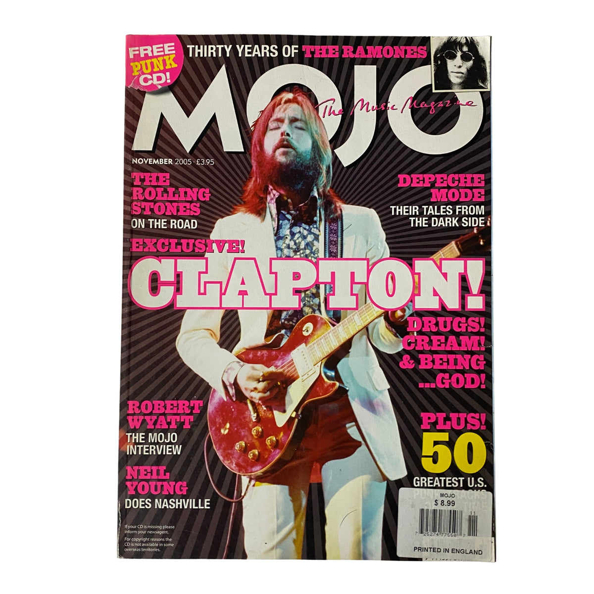 Mojo Music Magazine cover from November 2005 featuring Eric Clapton. Highlights include the mention of Depeche Mode, The Rolling Stones, and The Ramones, alongside a note about the absence of a CD.