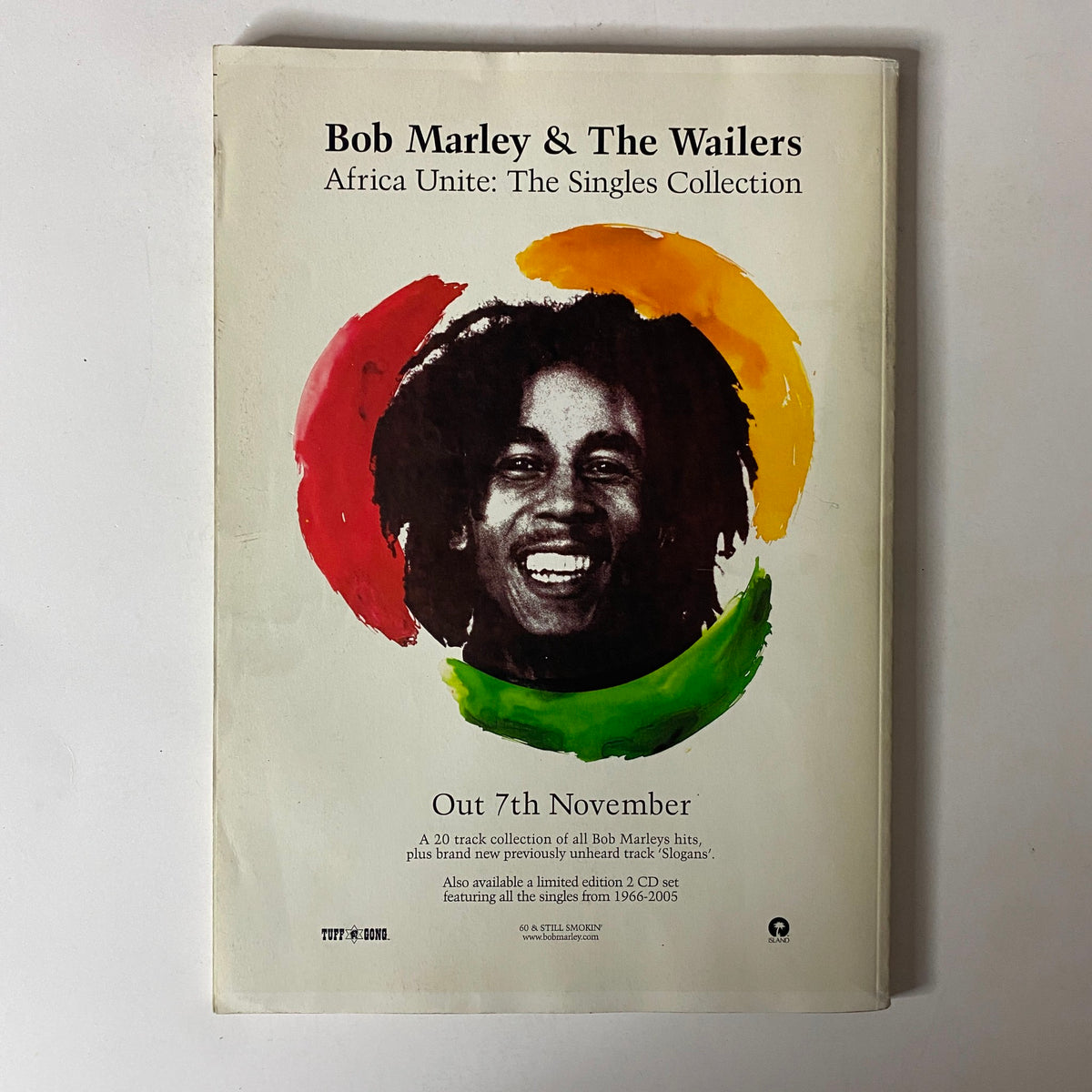 Mojo Music Magazine December 2005 back cover advertising Bob Marley & The Wailers 'Africa Unite: The Singles Collection,' featuring a striking image of Bob Marley.