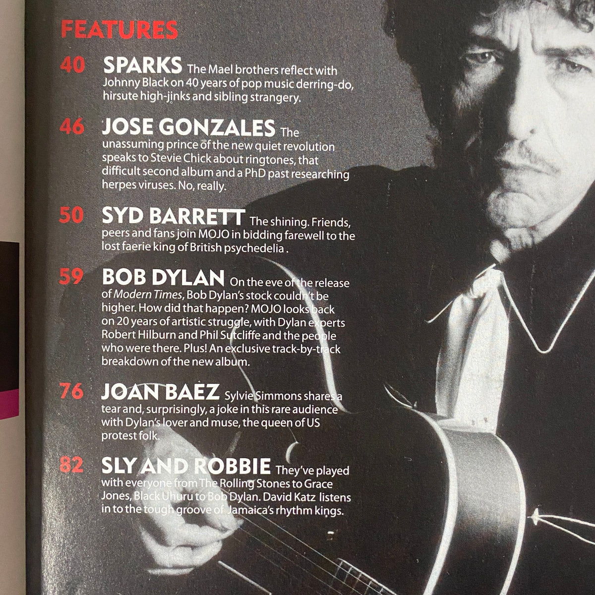 Inside view of Mojo Music Magazine September 2006, showcasing feature articles including Syd Barrett and Bob Dylan, offering insights into mid-2000s music culture.