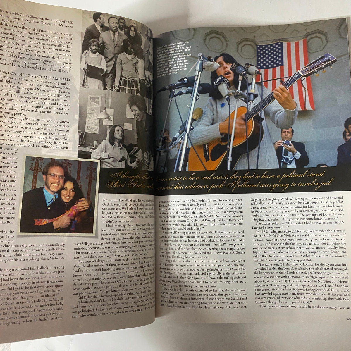Mojo Music Magazine September 2006 featuring an article about a musician performing with an American flag in the background. The page showcases a detailed narrative and photographs, highlighting the significance of the music culture.