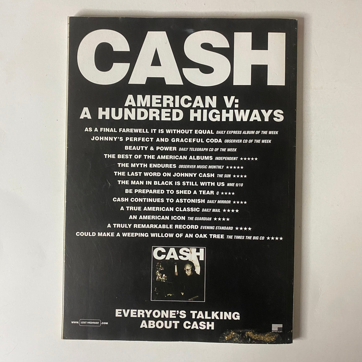 Mojo Music Magazine September 2006 showcasing a page with a review of Johnny Cash's album 'American V: A Hundred Highways'. The layout features prominent ratings and commentary about the album, underscoring its impact in music history.