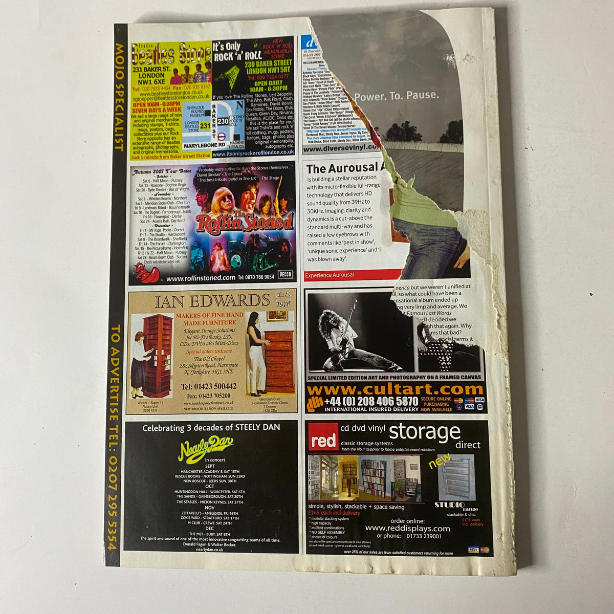 Mojo Music Magazine October 2007 showcasing the back cover with advertisements, illustrating the magazine's layout and condition, including a notable tear.