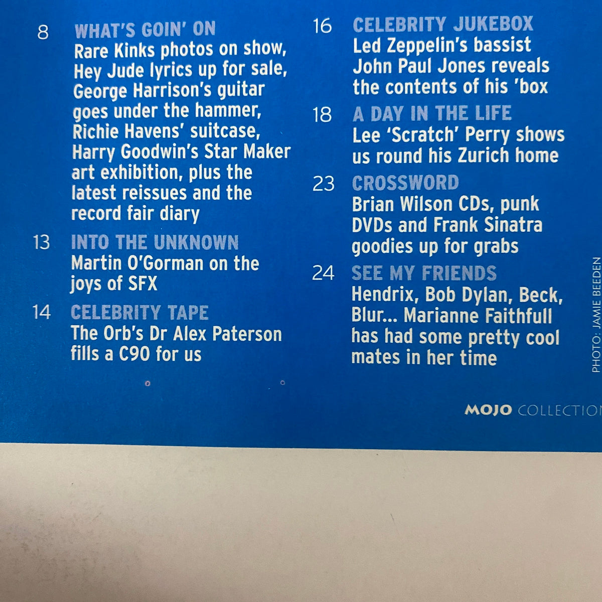 Interior page of Mojo Collections Magazine Spring 2002 showcasing articles including celebrity features and a crossword contest related to Brian Wilson and other iconic musicians.