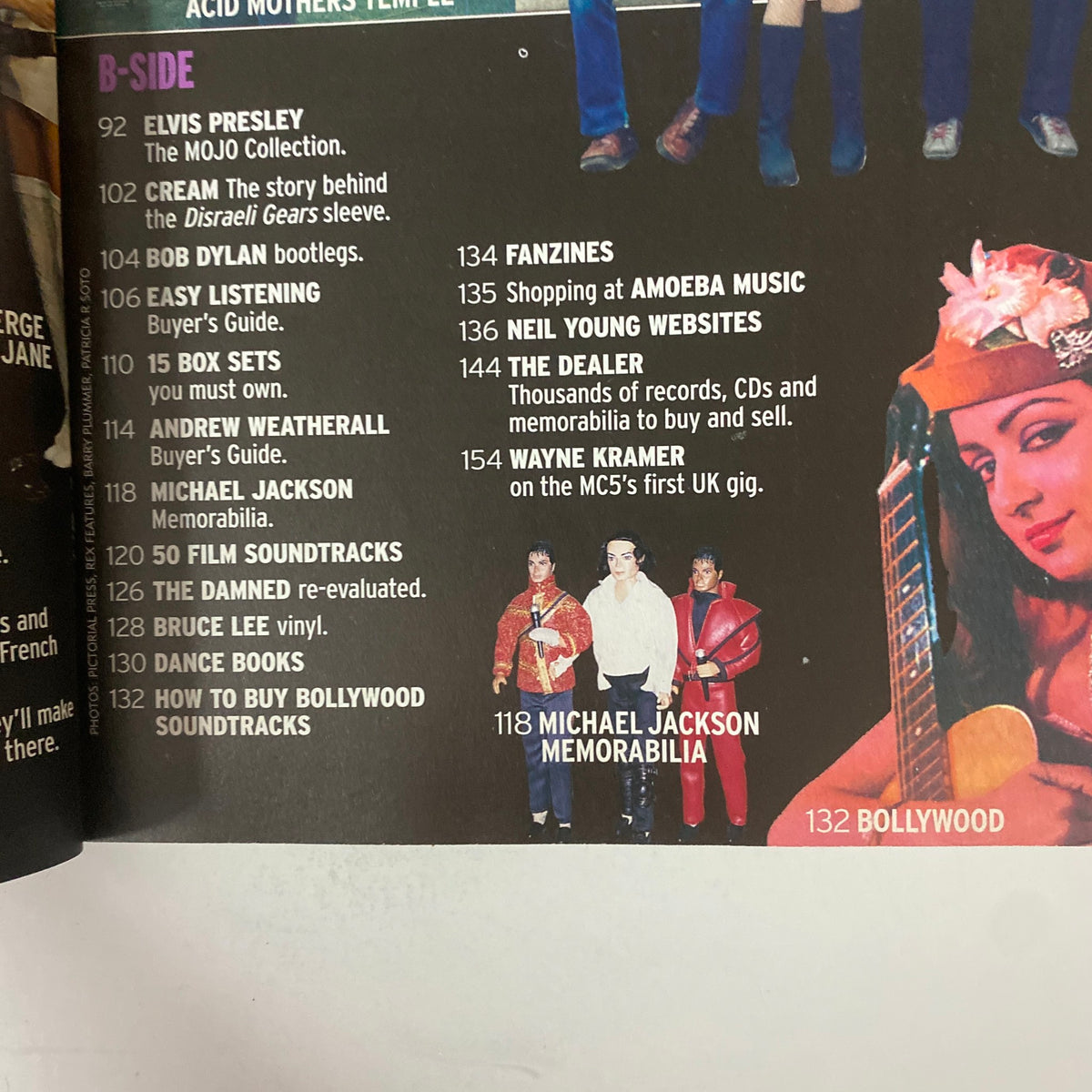 B-side content of Mojo Collections Magazine Winter 2001 detailing articles on Elvis Presley, Cream, Bob Dylan, and more diverse music topics.