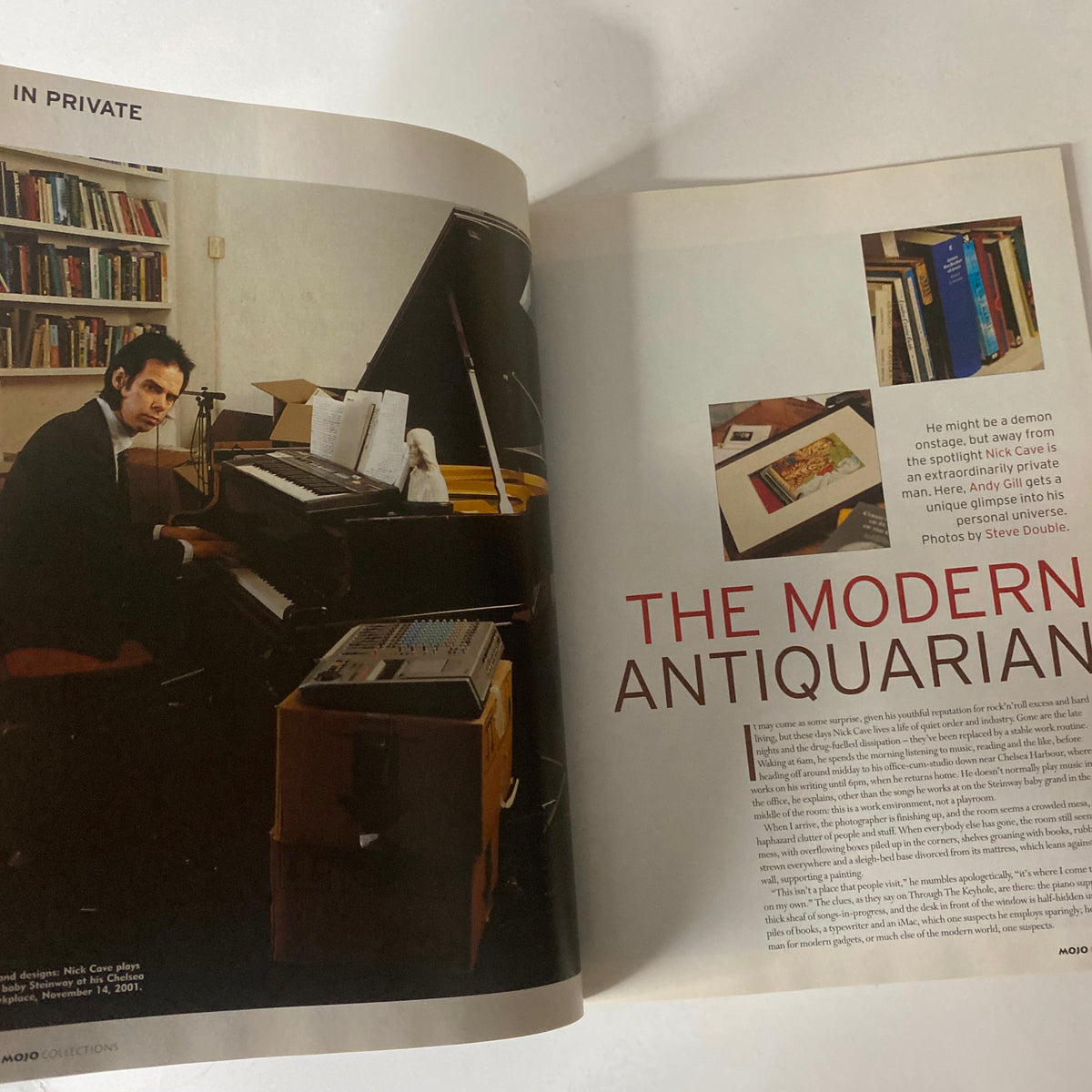 Inside spread of Mojo Collections Magazine Winter 2001 highlighting a feature on Nick Cave, showcasing images of him at a piano surrounded by books.