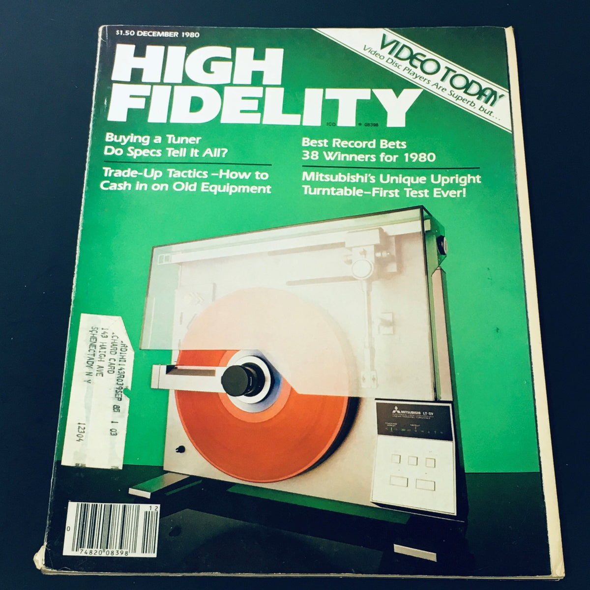 Cover of the December 1980 issue of High Fidelity Magazine featuring a Mitsubishi turntable with a red vinyl record. The magazine includes articles on cashing in on old audio equipment, the best record bets for the year, and essential insights for music enthusiasts.