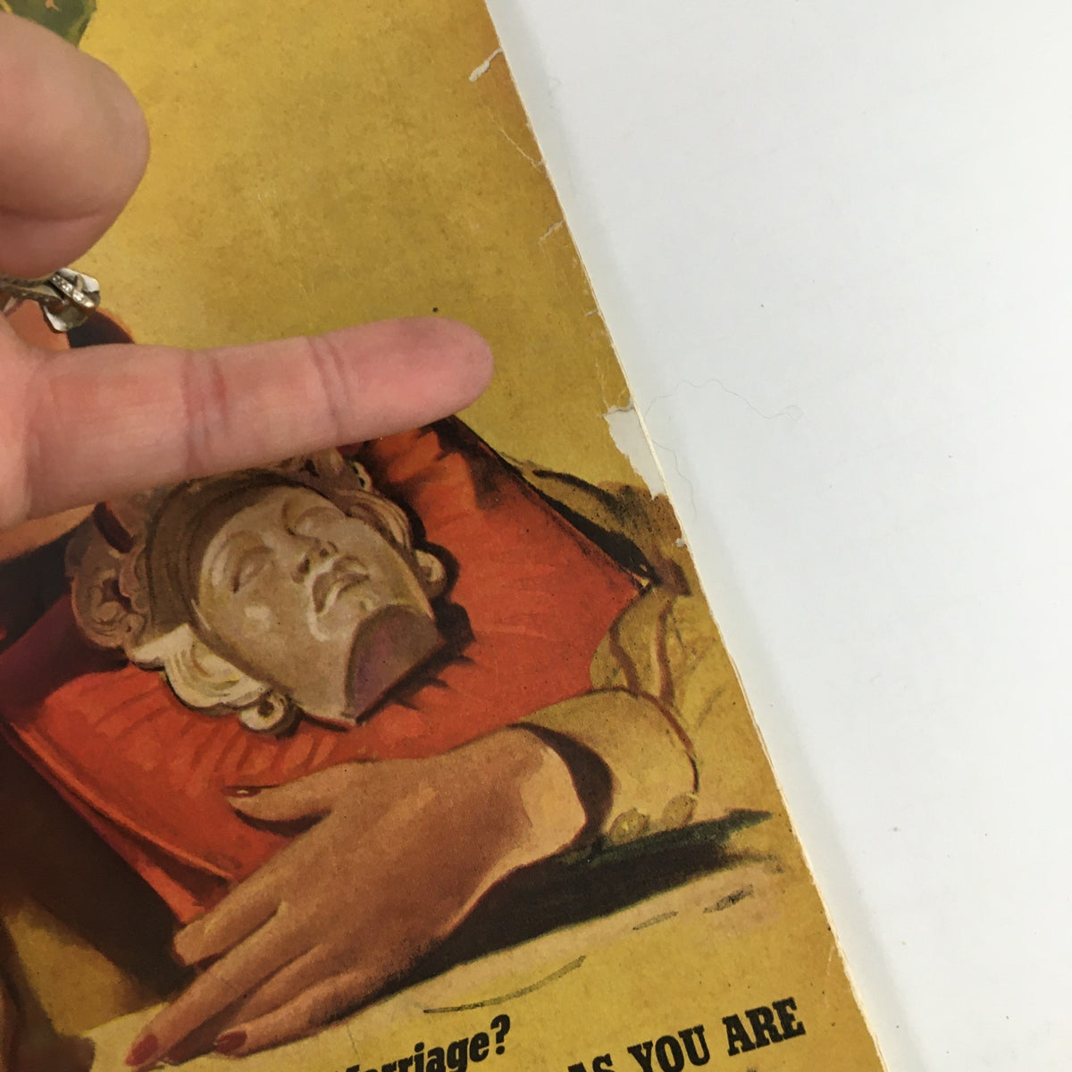 Close-up of the cover of VTG Cosmopolitan Magazine March 1940 highlighting a woman holding a decorative mask.