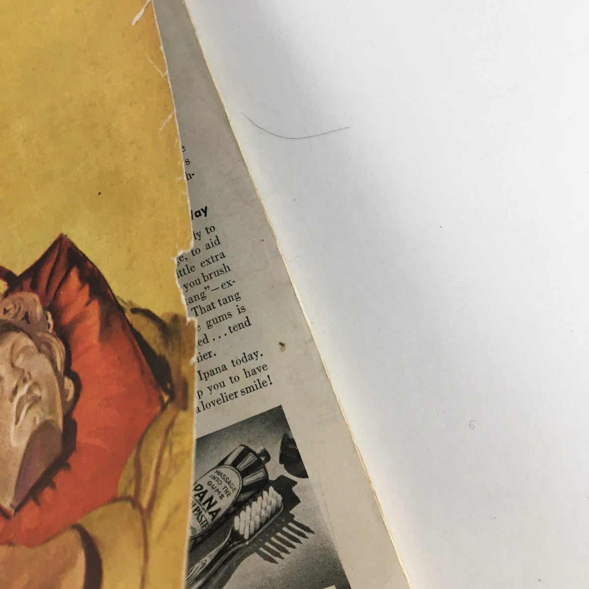 Close-up detail of the cover edge of VTG Cosmopolitan Magazine March 1940 showing wear and the magazine's title.