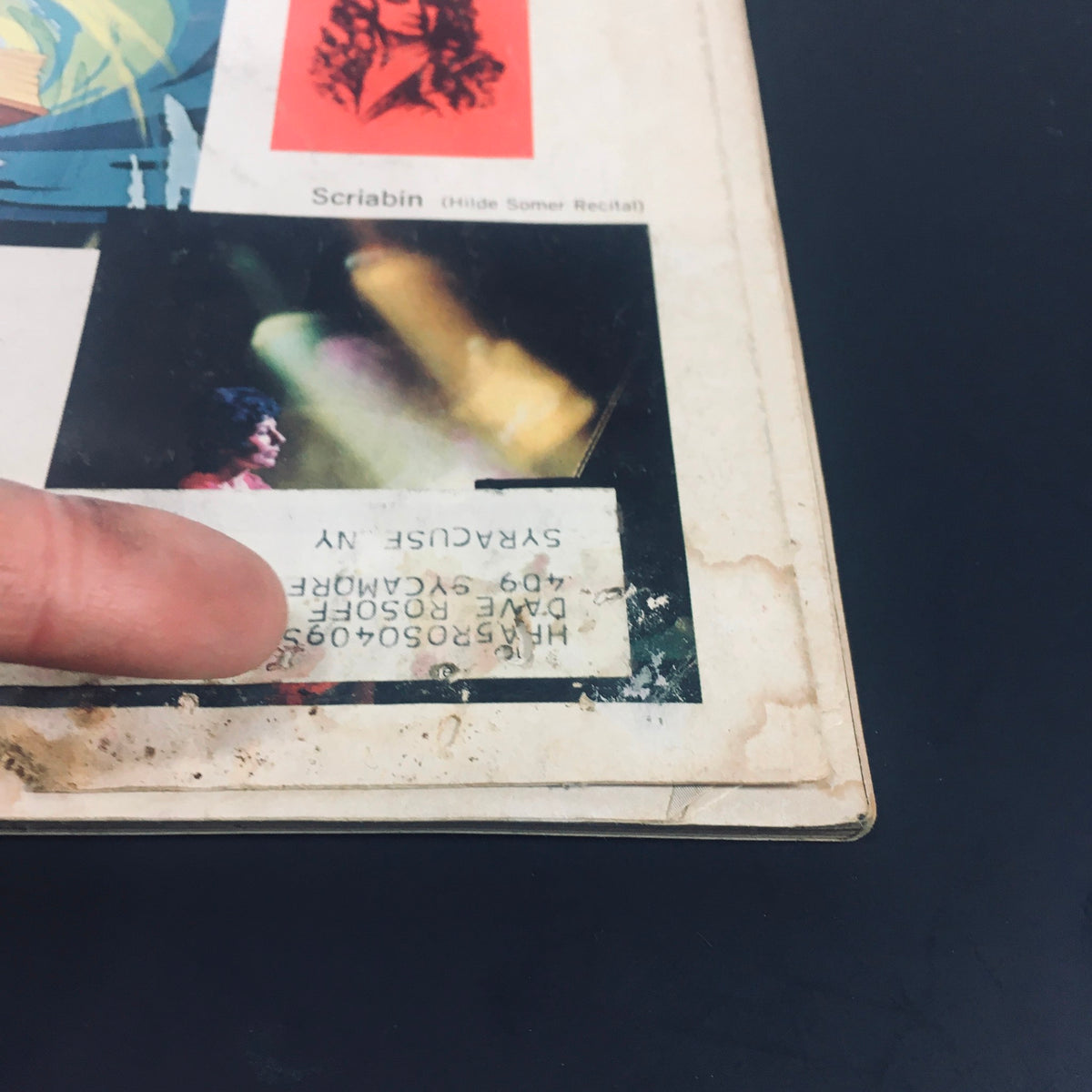 Detailed view of the lower section of the back cover of VTG High Fidelity Magazine March 1971, showcasing graphics and a label from a previous owner, with references to artists featured within.