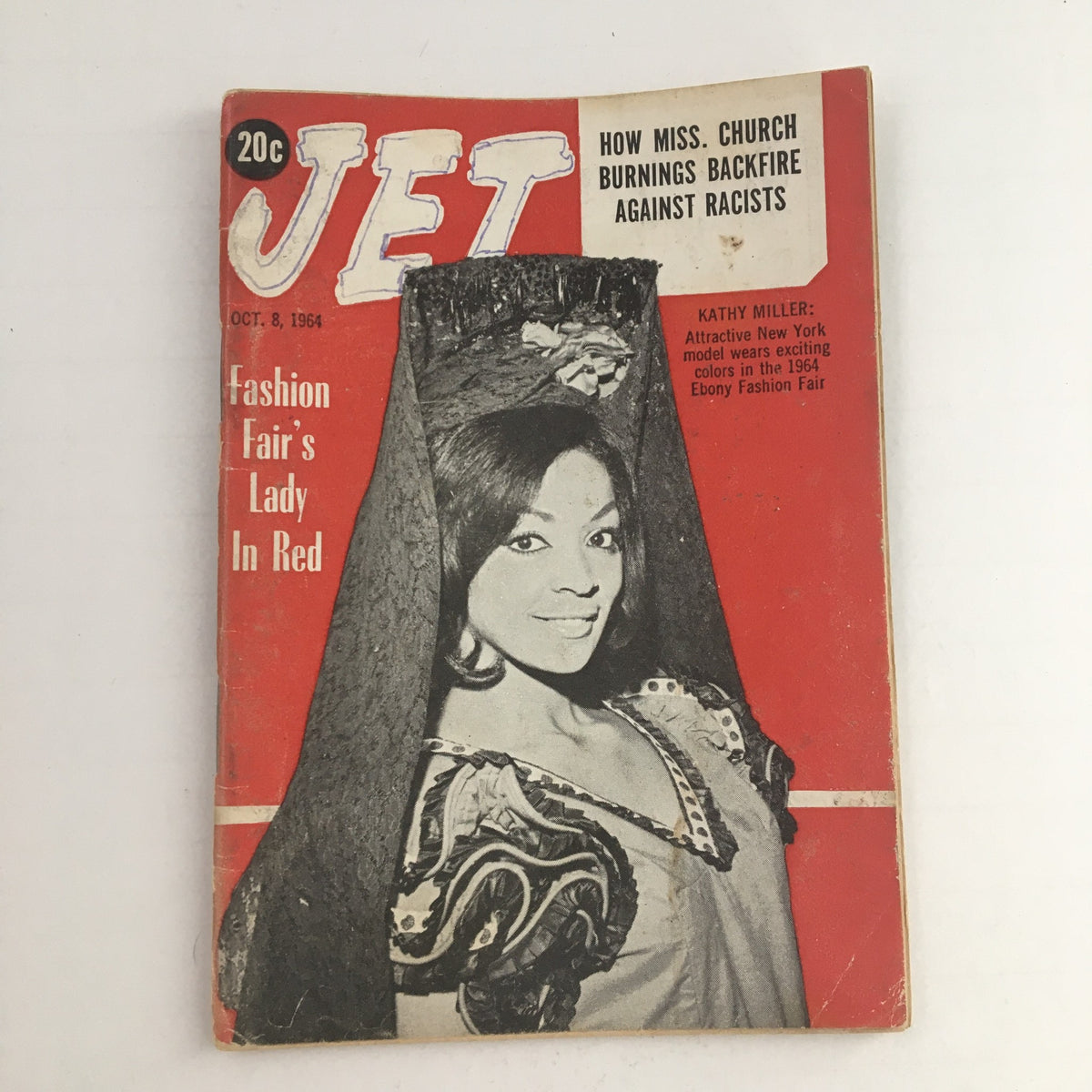 Jet Magazine October 8, 1964 featuring Kathy Miller at the Ebony Fashion Fair. The cover displays vibrant red colors and highlights the model in a unique fashion pose, showcasing the 1960s style and cultural significance of the era.