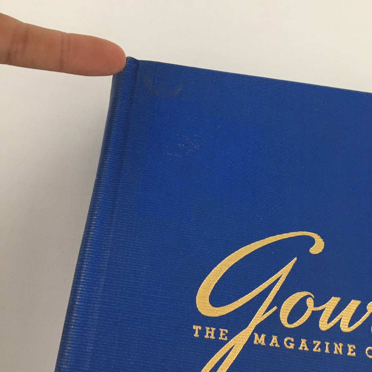 Close-up of the spine of "Gourmet: The Magazine of Good Living" Volume 5, showcasing its blue cover and worn condition.