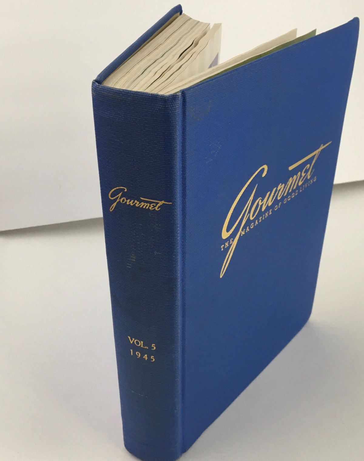 Side view of "Gourmet: The Magazine of Good Living" Volume 5 from 1945, displaying the title and year on its spine.