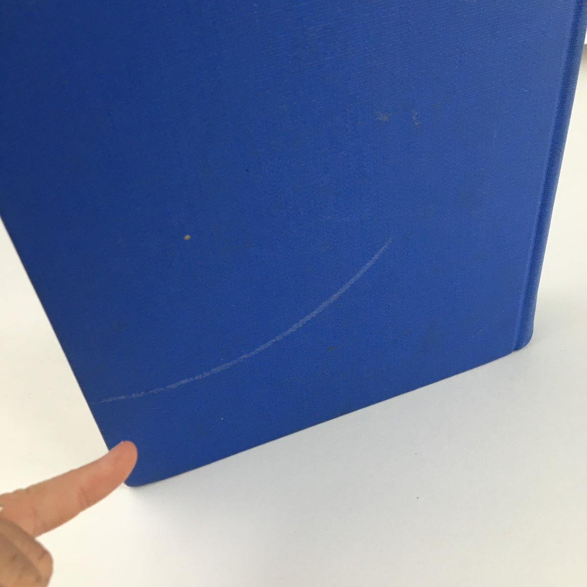 Back view of "Gourmet: The Magazine of Good Living" Volume 5, highlighting scratches and wear on the blue cover.