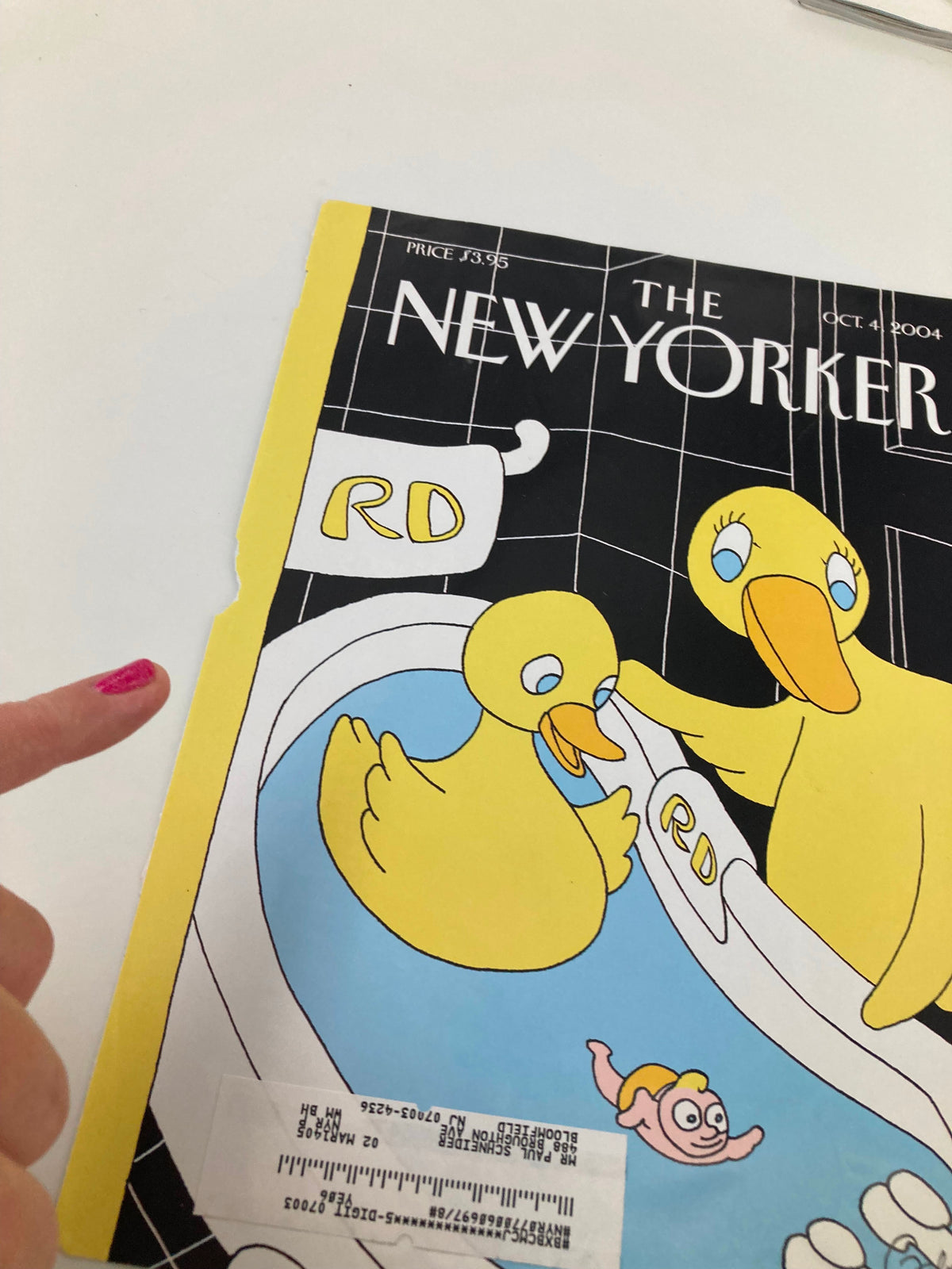 Close-up view of The New Yorker magazine cover from October 4, 2004, highlighting the artwork by Gahan Wilson, featuring rubber duckies in a playful bathtub scene. Includes visible wear details.