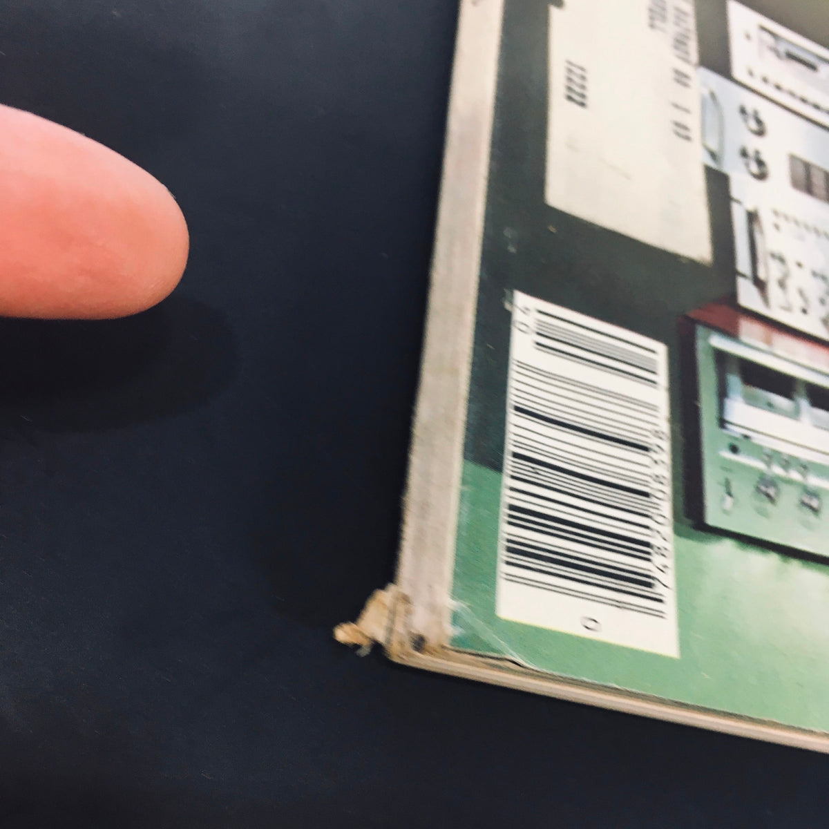 Side view of VTG High Fidelity Magazine, April 1978, indicating wear and tear, with a focus on details and barcode on the back cover.