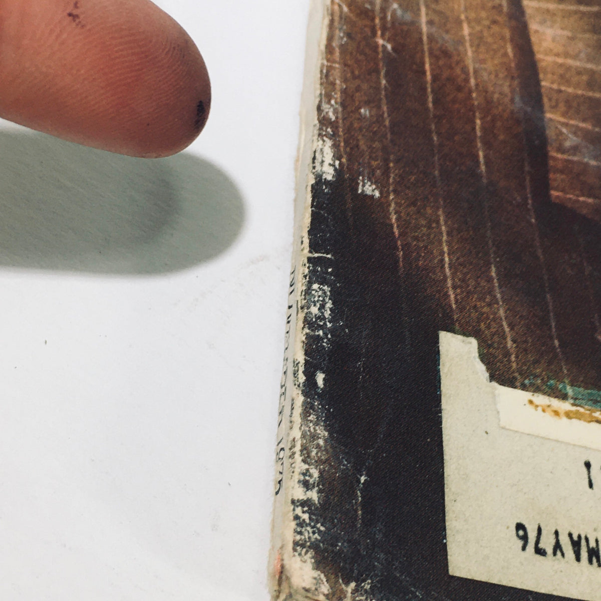 A close-up image of the edge of the November 1975 Stereo Review Magazine, showing signs of wear and an addressed label, indicating its vintage condition.