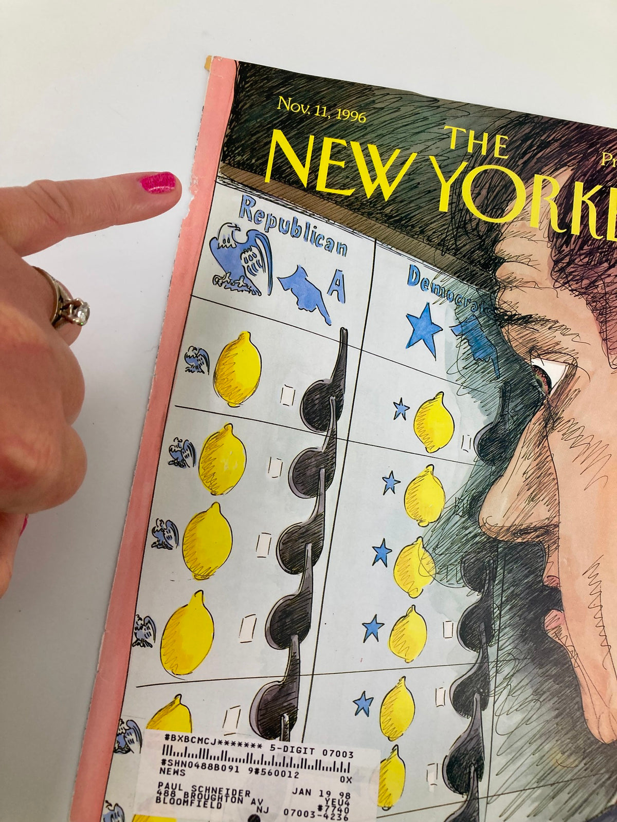 Close-up of The New Yorker cover from November 11, 1996, titled 'The Same Coin' by E. Sorel, detailing the visual elements representing Democrats and Republicans with artistic illustration.