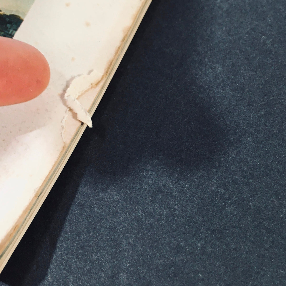 Close-up of the edge of the January 1989 issue of VTG High Fidelity Magazine, showcasing minor wear and a small rip, capturing the vintage character of this collectible magazine about Music in California.
