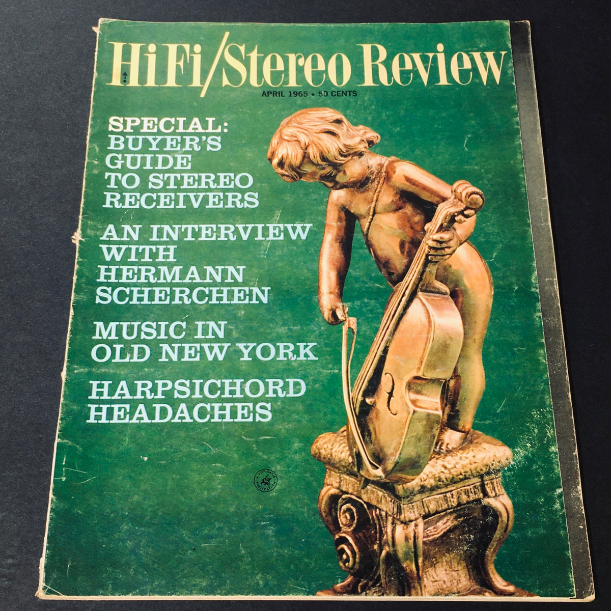 VTG HiFi Stereo Review Magazine April 1965 cover featuring a wooden sculpture of a boy playing a cello, highlighting an interview with Hermann Scherchen and a buyer's guide to stereo receivers.