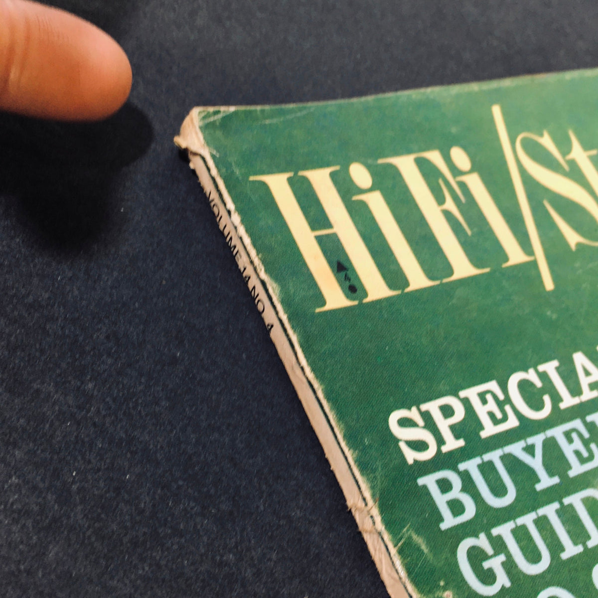 Close-up view of the spine of the VTG HiFi Stereo Review Magazine April 1965, showing wear and details of the publication title, volume number, and special features.
