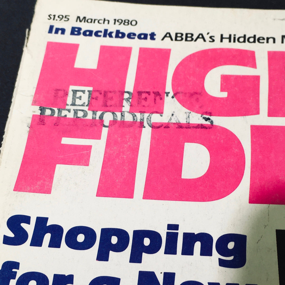 Cover detail of VTG High Fidelity Magazine March 1980 featuring ABBA's Hidden Millions, showcasing vibrant pink lettering and minor wear typical of vintage publications.