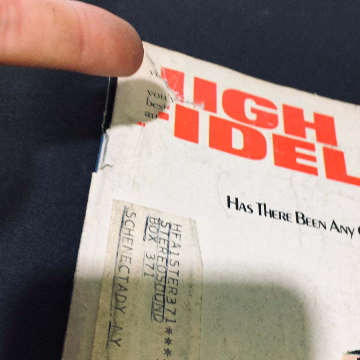 Close-up of the corner of High Fidelity Magazine September 1973 with a visible address label and a tear, highlighting its vintage condition.