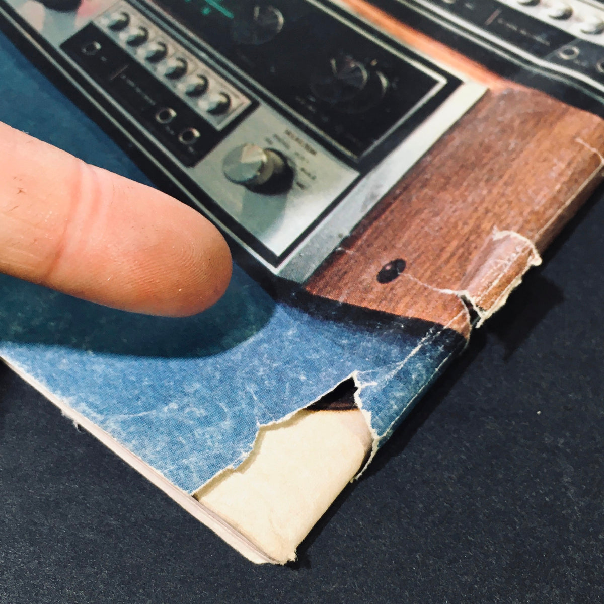 Image highlighting a corner of High Fidelity Magazine September 1973, featuring vintage audio equipment and signs of wear on the cover.