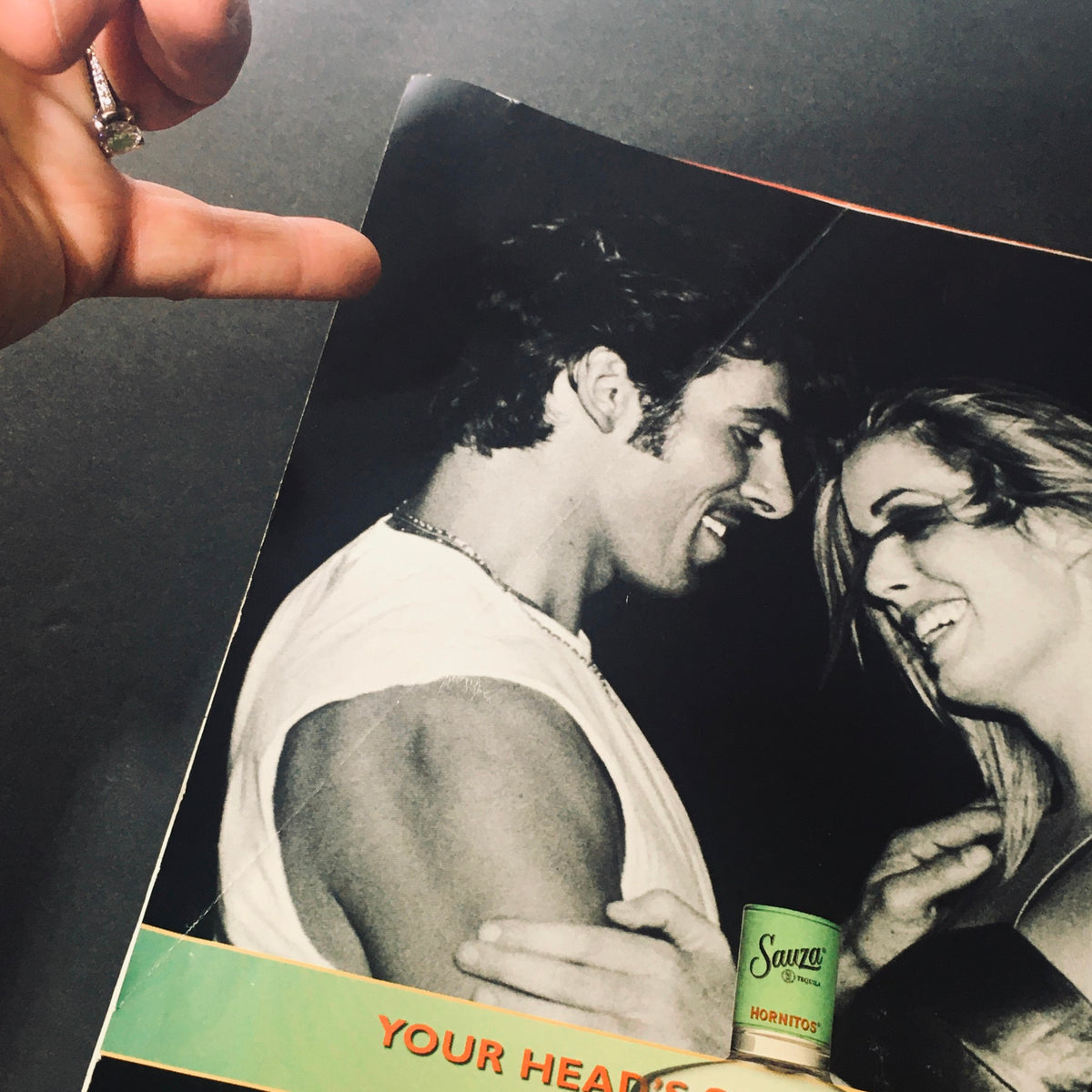 Inside FHM Magazine July August 2001 showing a black and white photo of a man and woman enjoying a playful moment, capturing the magazine's vibrant appeal.