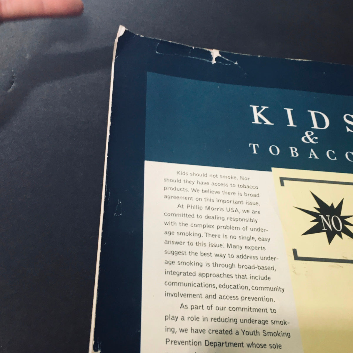 Back cover detail from FHM Magazine October 2000 featuring a statement on Kids and Tobacco prevention, highlighting its significance in promoting awareness on smoking issues.