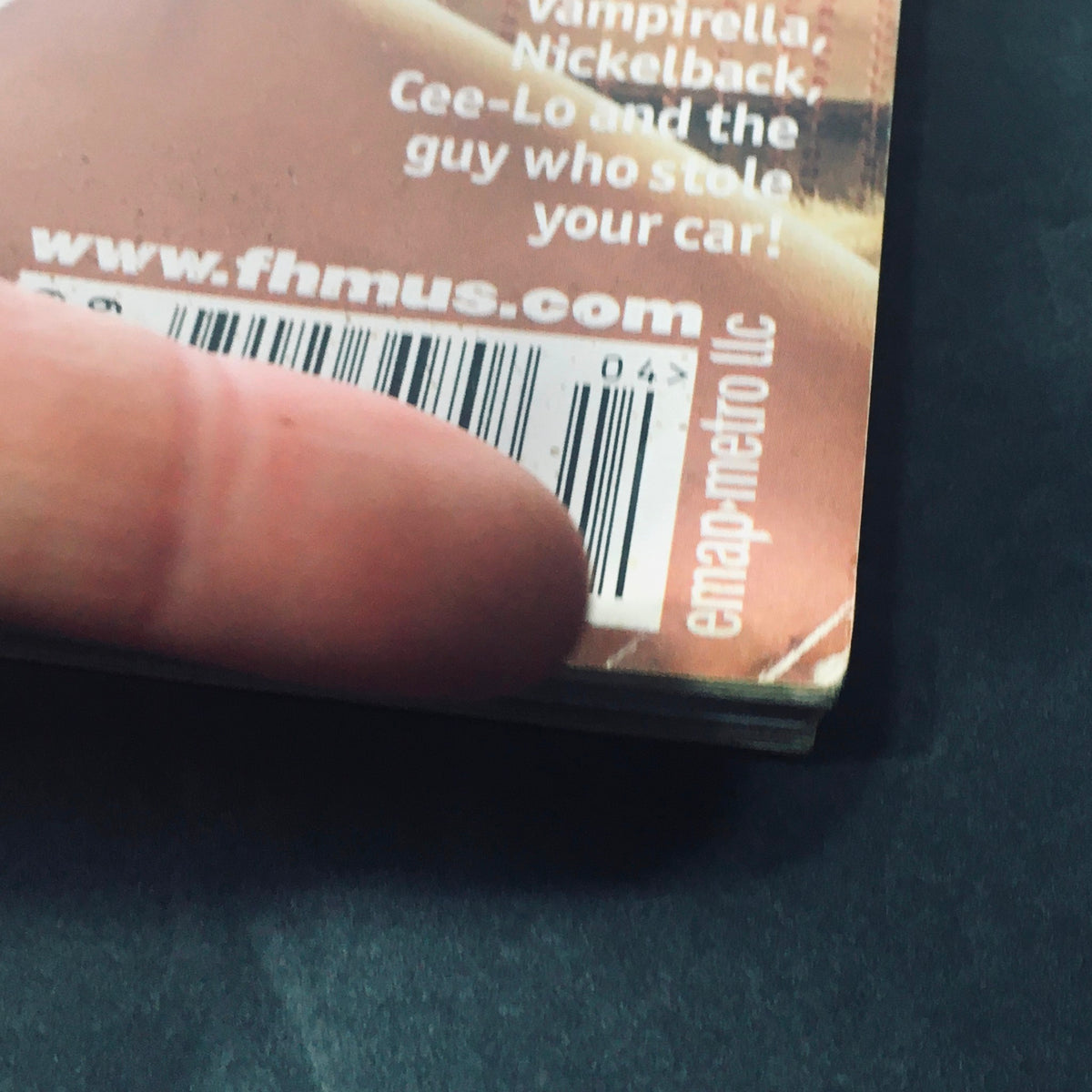 Close-up image of FHM Magazine April 2002 featuring a barcode, highlighting its collectible nature as a newsstand issue.