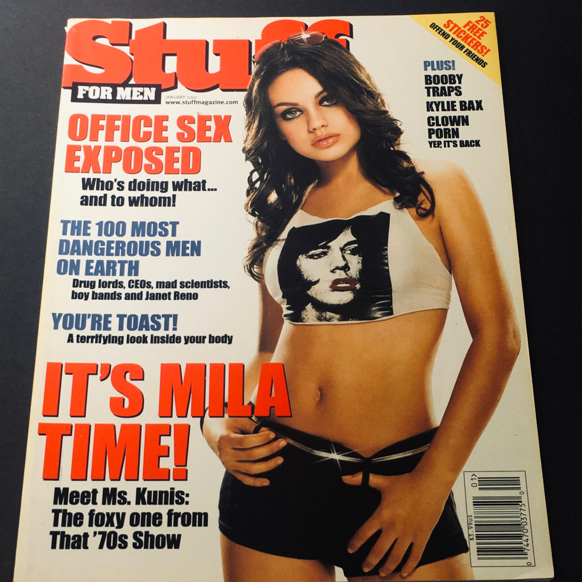 Cover of Stuff For Men Magazine January 2001 featuring Mila Kunis from That '70s Show, showcasing her in a stylish outfit with an emphasis on the theme 'It's Mila Time!'.