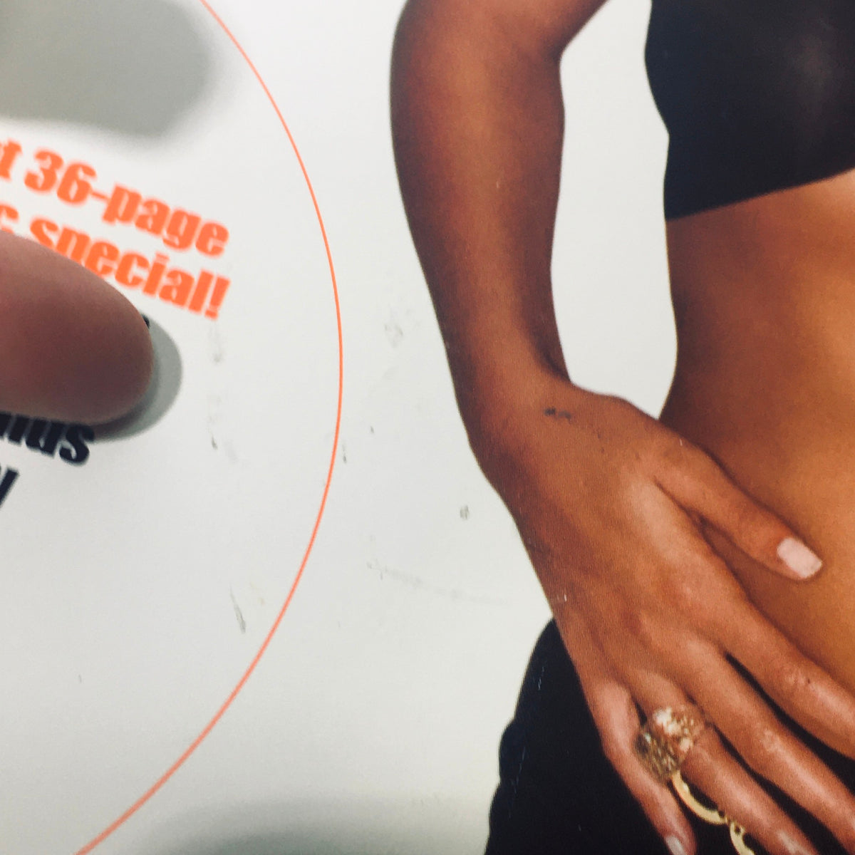 Close-up detail of a model's hand resting on the cover of Stuff For Men Magazine April 2001, highlighting fashion elements from the early 2000s.