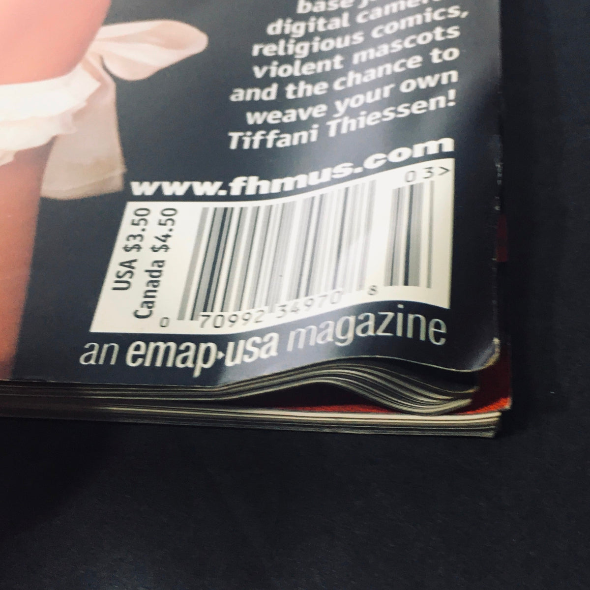 Close-up of FHM Magazine March 2001 showing the barcode and publication details, highlighting its status as a vintage collectible.