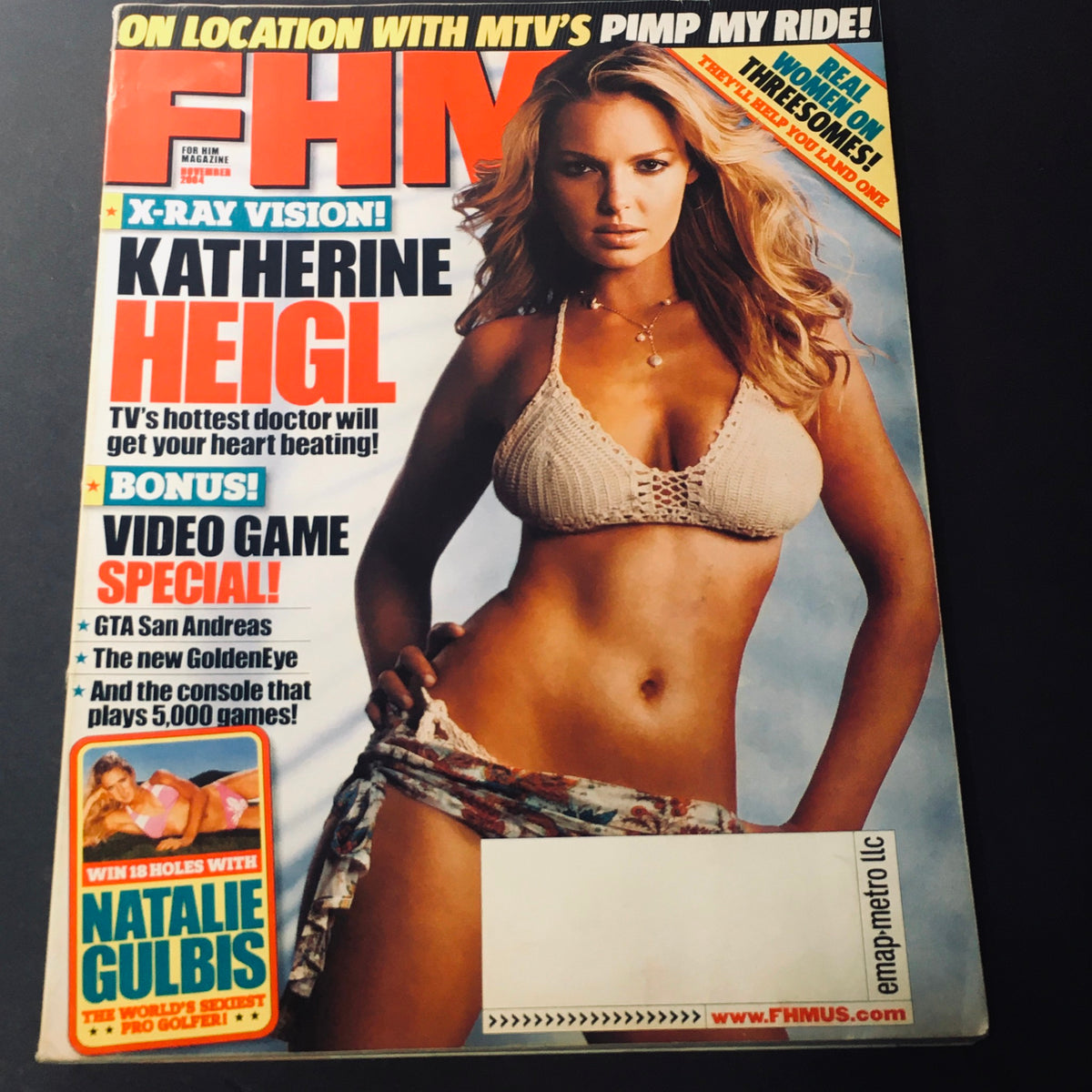 FHM Magazine November 2004 featuring Katherine Heigl, TV's hottest doctor, on the cover in a stunning pose. This vintage magazine encapsulates early 2000s pop culture.