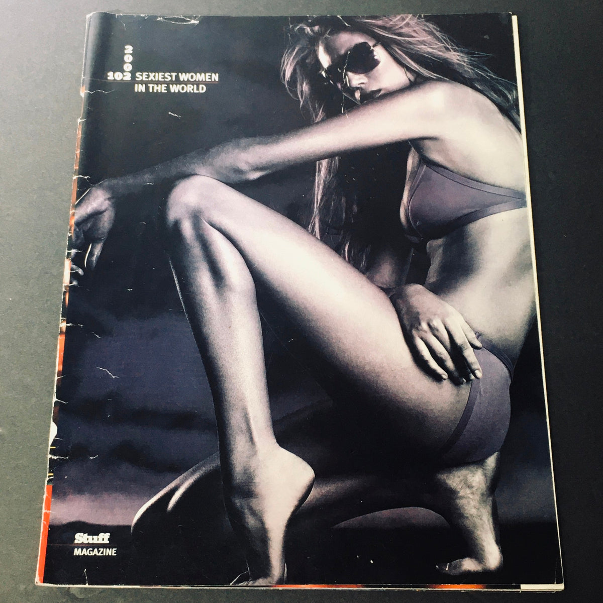 Cover of Stuff For Men Magazine October 2002 featuring the theme 'Sexiest Women In The World' with an artistic image of a woman in a bikini.