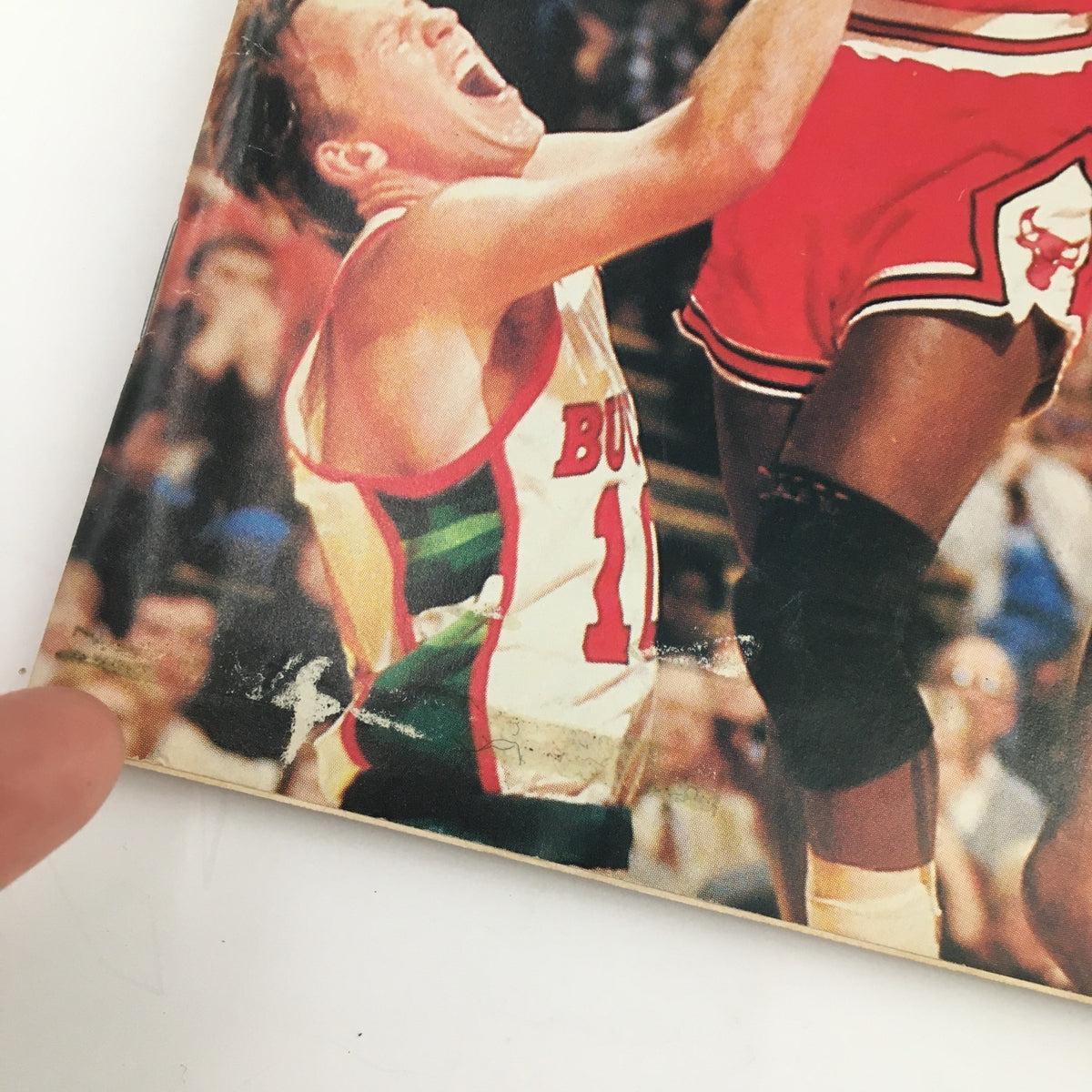 Close-up of the Sports Illustrated Magazine from December 10, 1984, highlighting Michael Jordan, showcasing wear and tear typical of vintage publications.