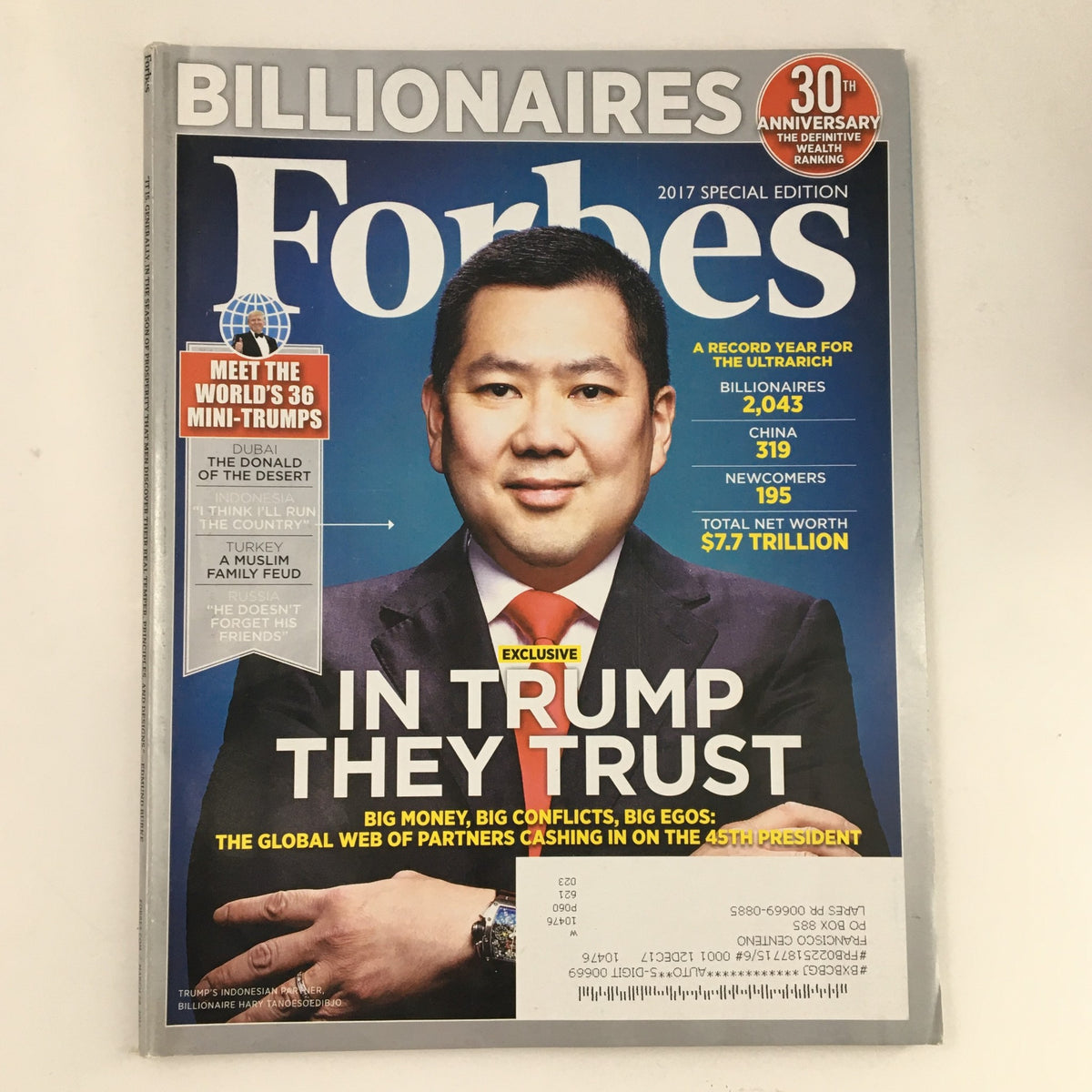 Forbes Magazine March 28 2017 cover featuring 'In Trump They Trust' with a portrait of a businessman and a headline about global wealth.