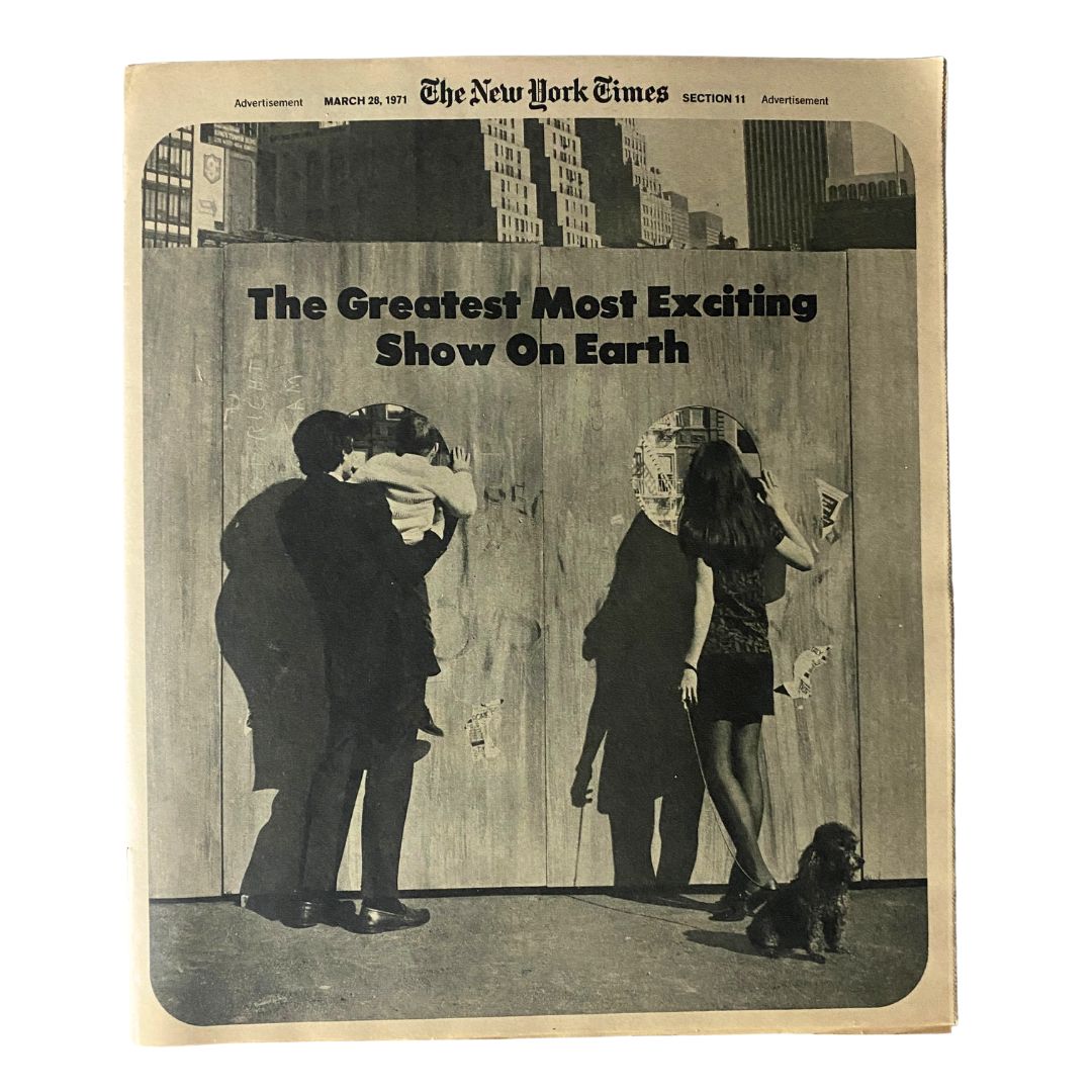 Cover of The New York Times Magazine dated March 28, 1971, featuring the headline 'The Greatest Most Exciting Show On Earth', displaying a black and white photograph of people looking through peep holes in a wooden wall.